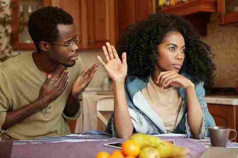 please forgive me unhappy african american male cheater holding hand his chest apologizing beautiful indifferent woman who ignoring refusing all his excuses telling him get lost