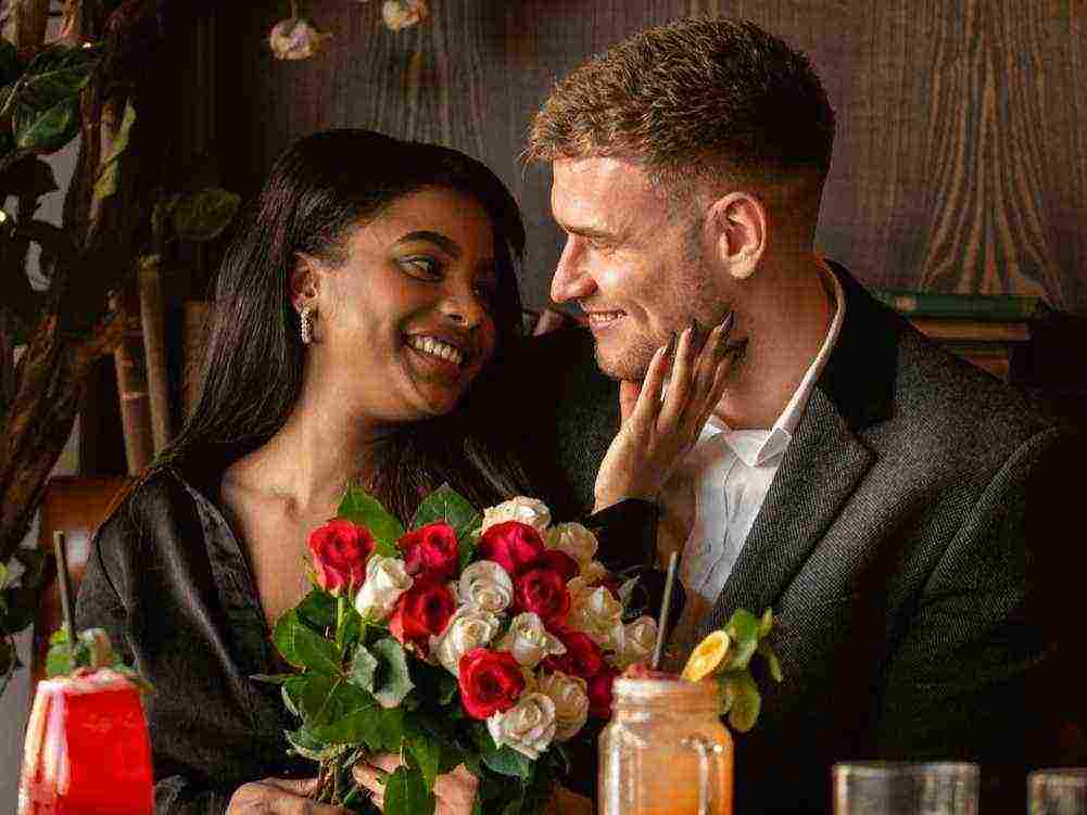 young woman having bouquet roses from her boyfriend