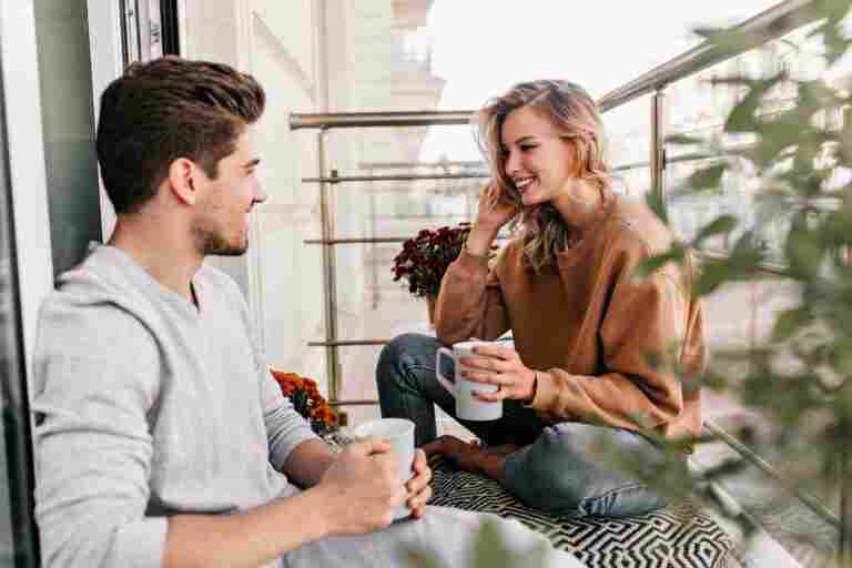 cheerful lady talking with husband balcony charming young woman drinking tea terrace