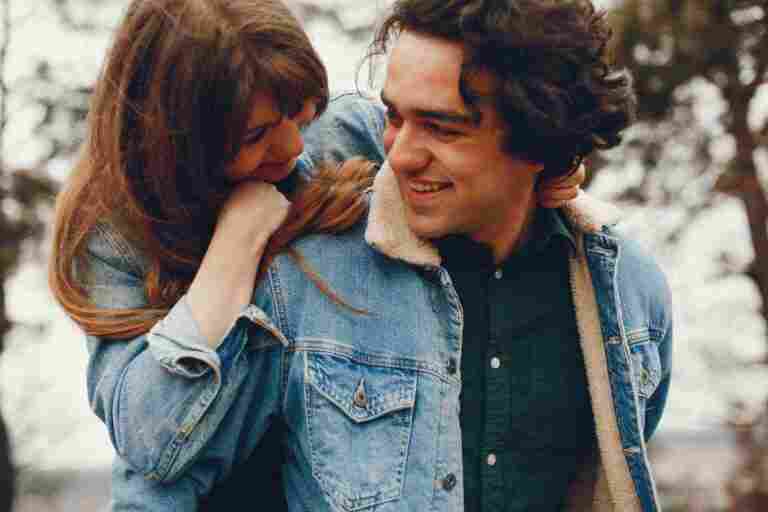gentle stylish couple are having walk autumn park