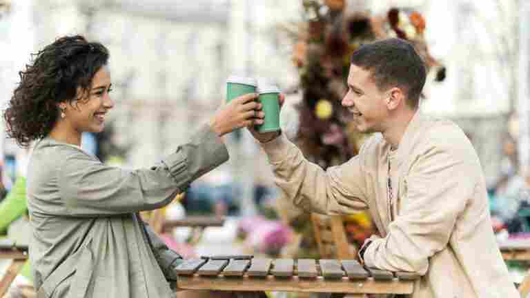 happy couple outdoors near cafe