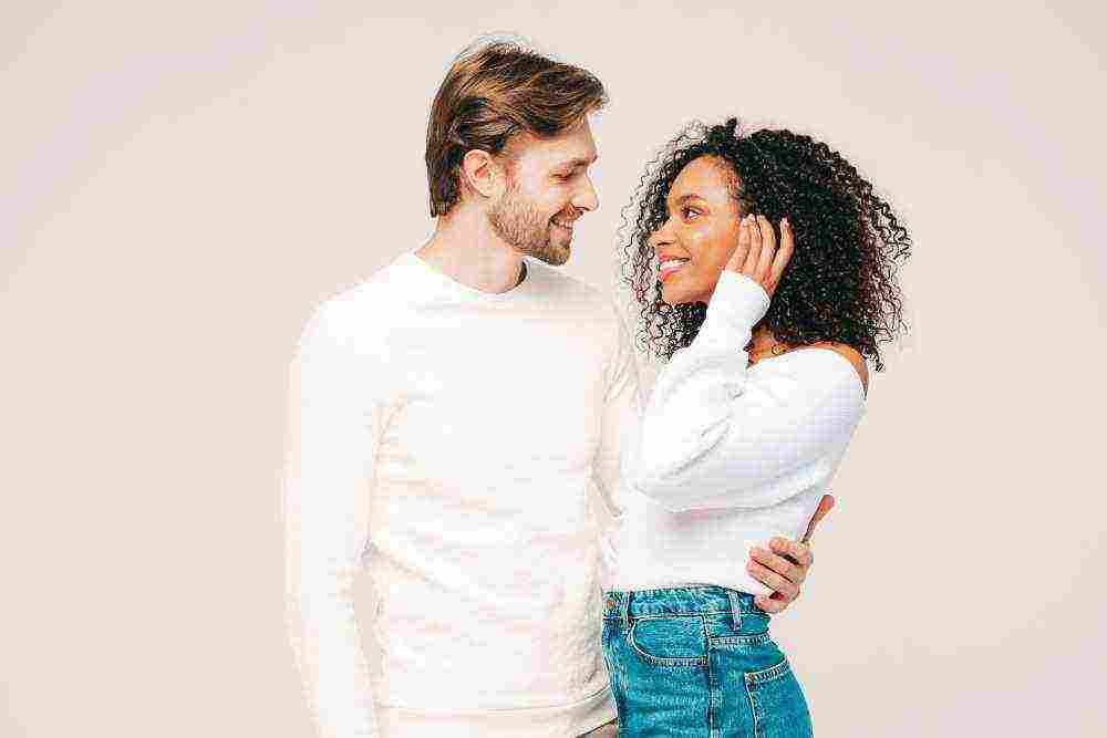 smiling beautiful woman her handsome boyfriend happy cheerful multiracial family having tender moments grey