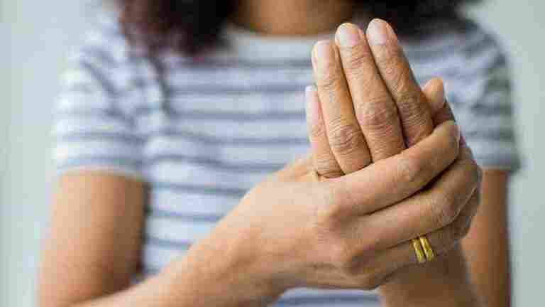 women using hand hold palm fingers with feeling pain suffer hurt tingling concept guillain barre syndrome numb hands disease 102814 531