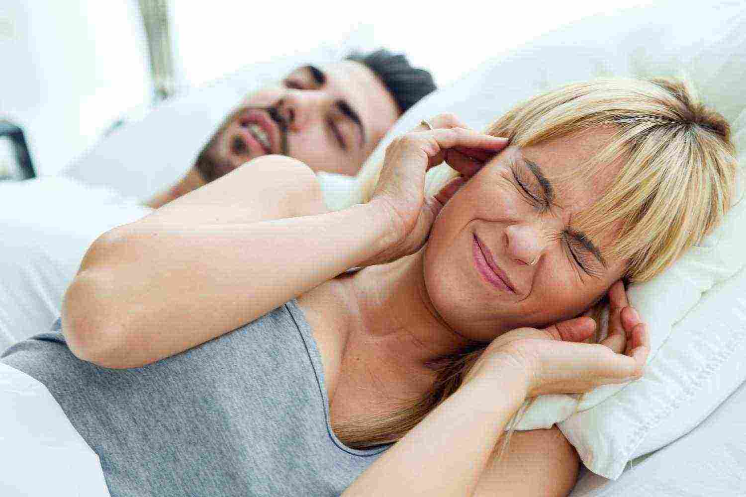 young woman who can sleep because her husband snores