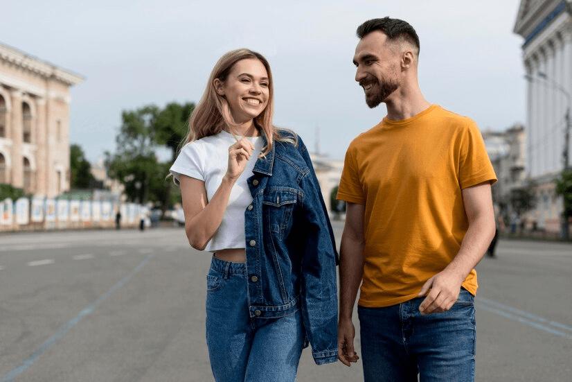 Guy wrapping his hands around the girl's shoulder meaning.