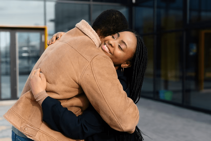 Girl hugging guy tight