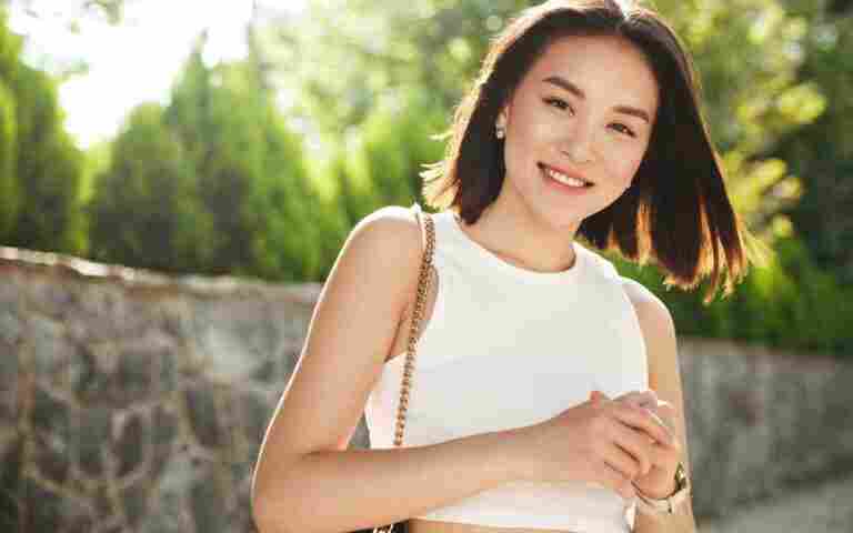 image modern asian woman standing park smiling