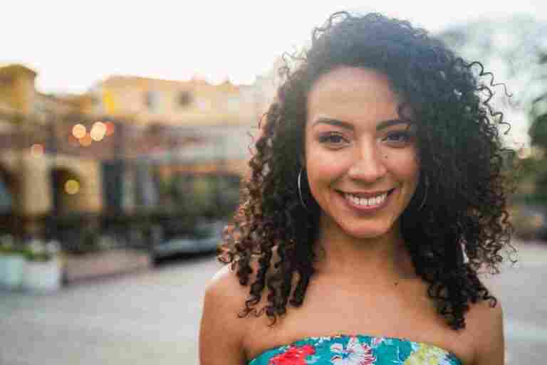 portrait beautiful afro american latin confident woman laughing street outdoors