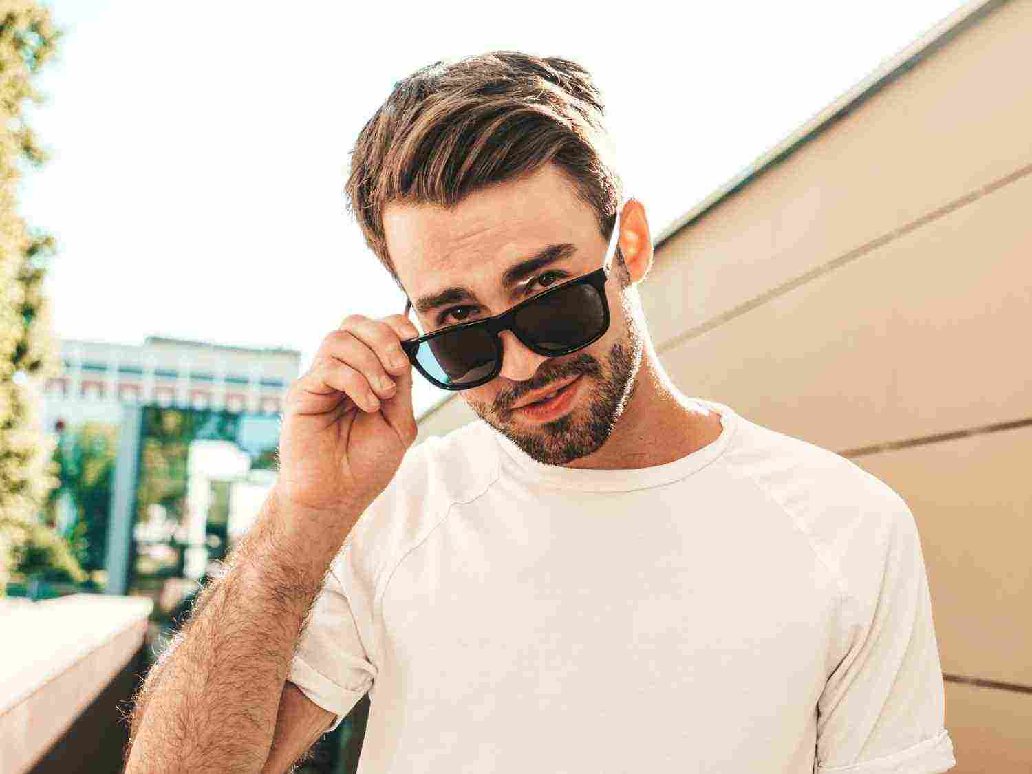 portrait handsome smiling stylish hipster lambersexual model