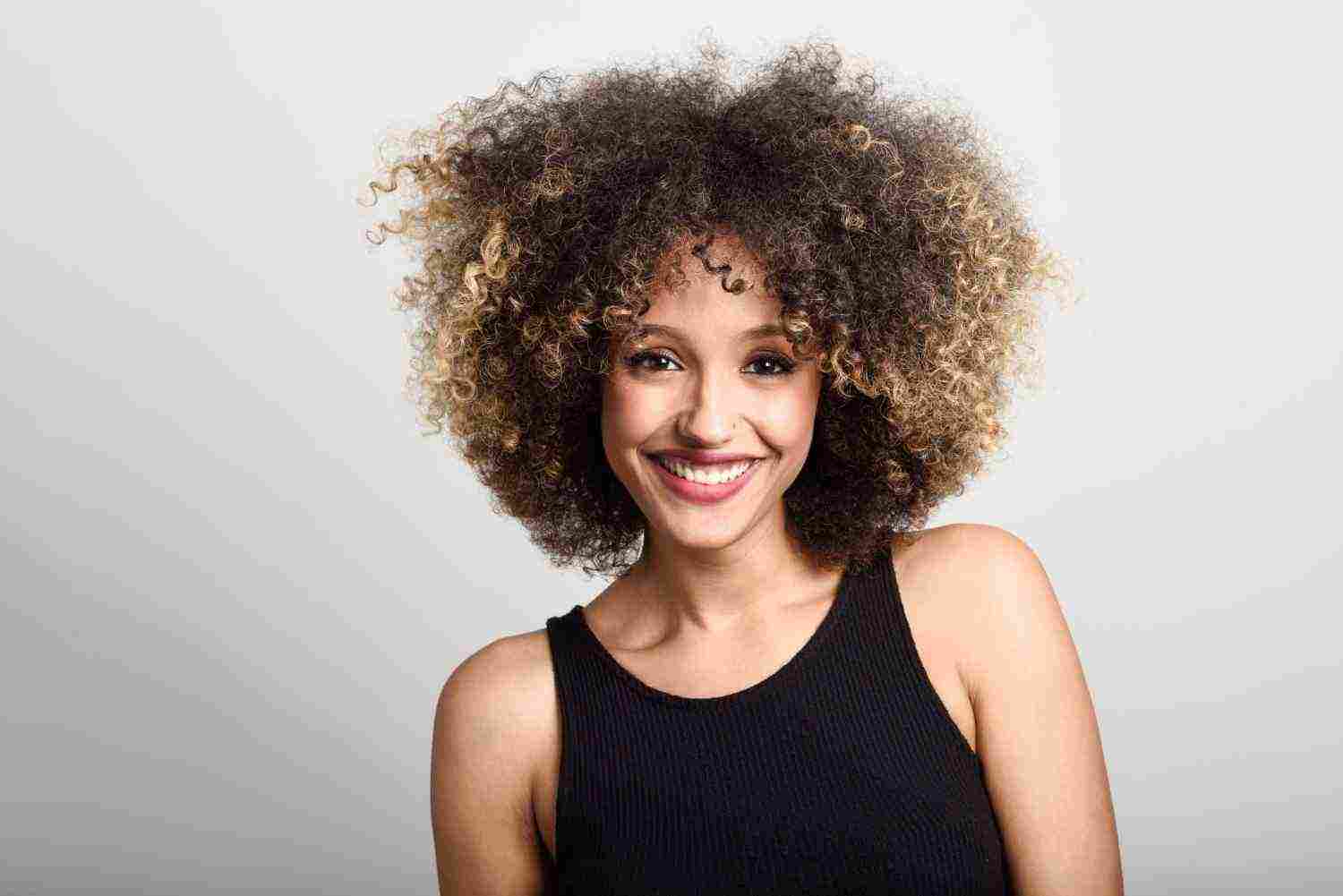 woman smiling face with curly hair