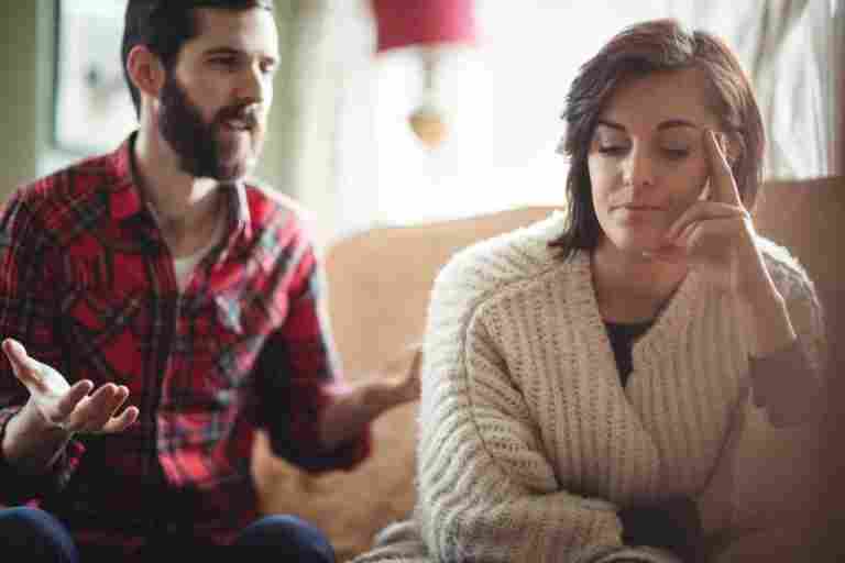couple arguing each other living room