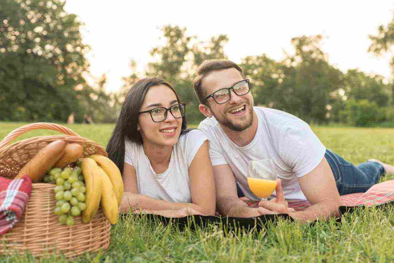 couple posing picnic blanket