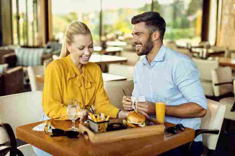 happy couple enjoying meal restaurant