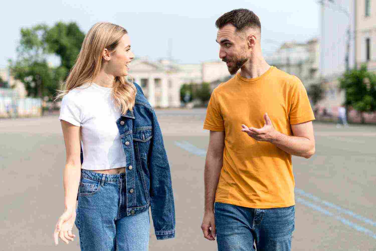 happy couple walking talking streets