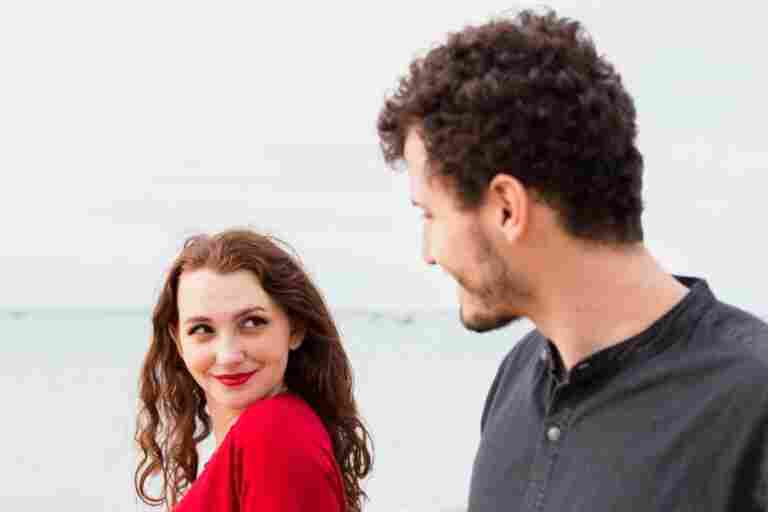 happy woman with man sea shore