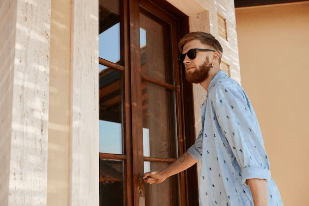 Gentle man holding door