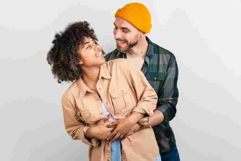 man embracing afro american woman looking each other1