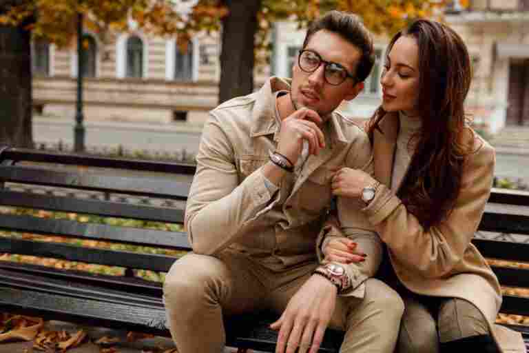 romantic portrait young beautiful couple love hugging kissing bench autumn park wearing stylish beige coat