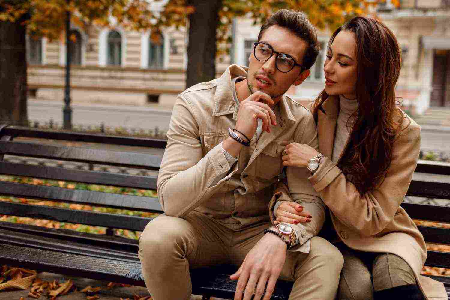romantic portrait young beautiful couple love hugging kissing bench autumn park wearing stylish beige coat