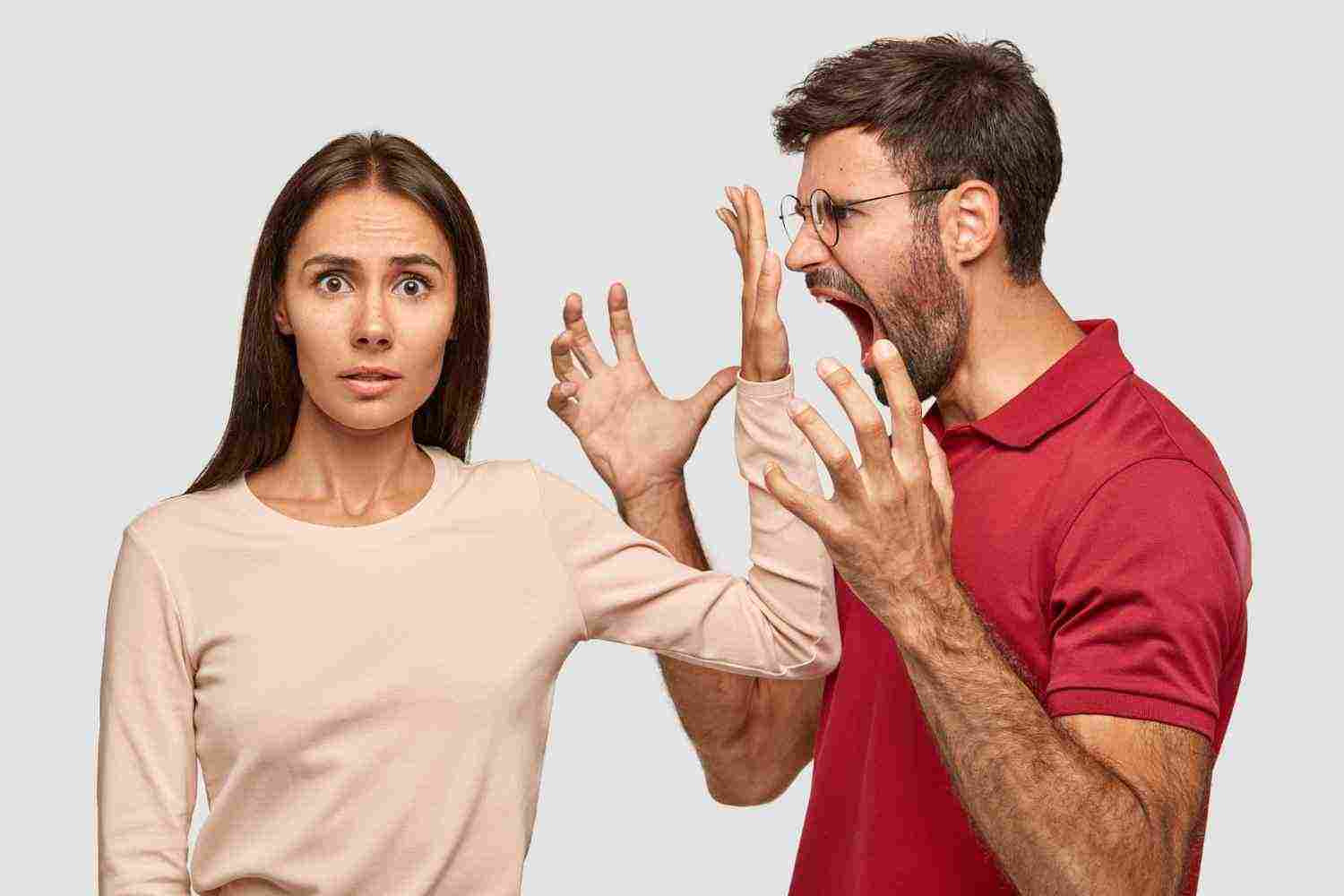 shut up puzzled beautiful woman keeps palm near husbands mouth
