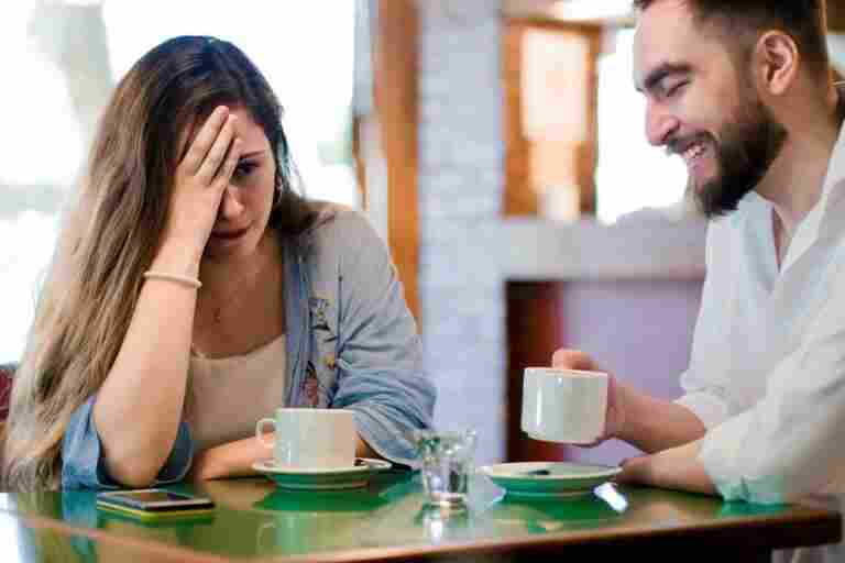 woman getting bored date coffee shop