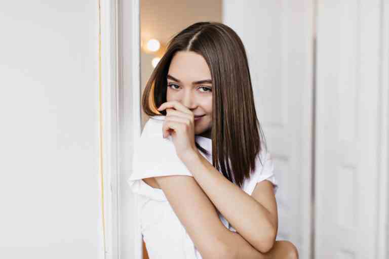 shy lovely girl with dark eyes having fun home indoor shot stunning brunette woman wears casual tshirt