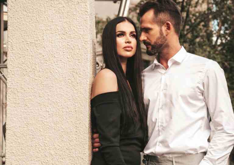 beautiful fashion woman her handsome elegant boyfriend suit sexy brunette model black evening dress fashionable couple posing street europe brutal man his female outdoors
