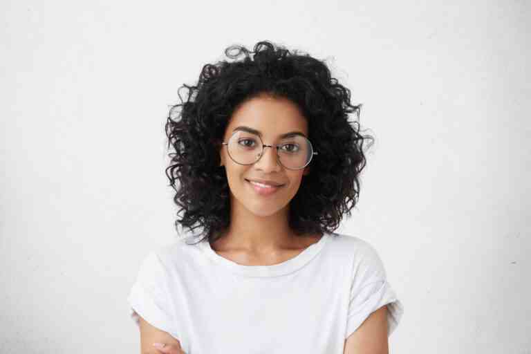close up studio shot beautiful young mixed race woman model with curly dark hair