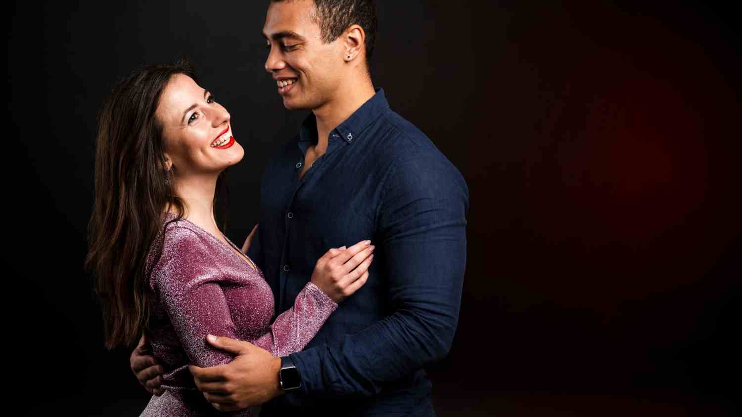 young couple holding each other new years eve