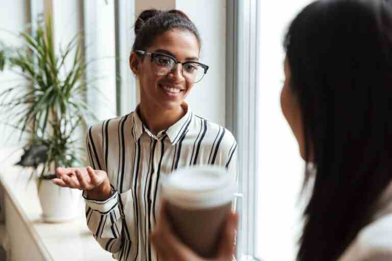 businesswomen colleagues talking with each other