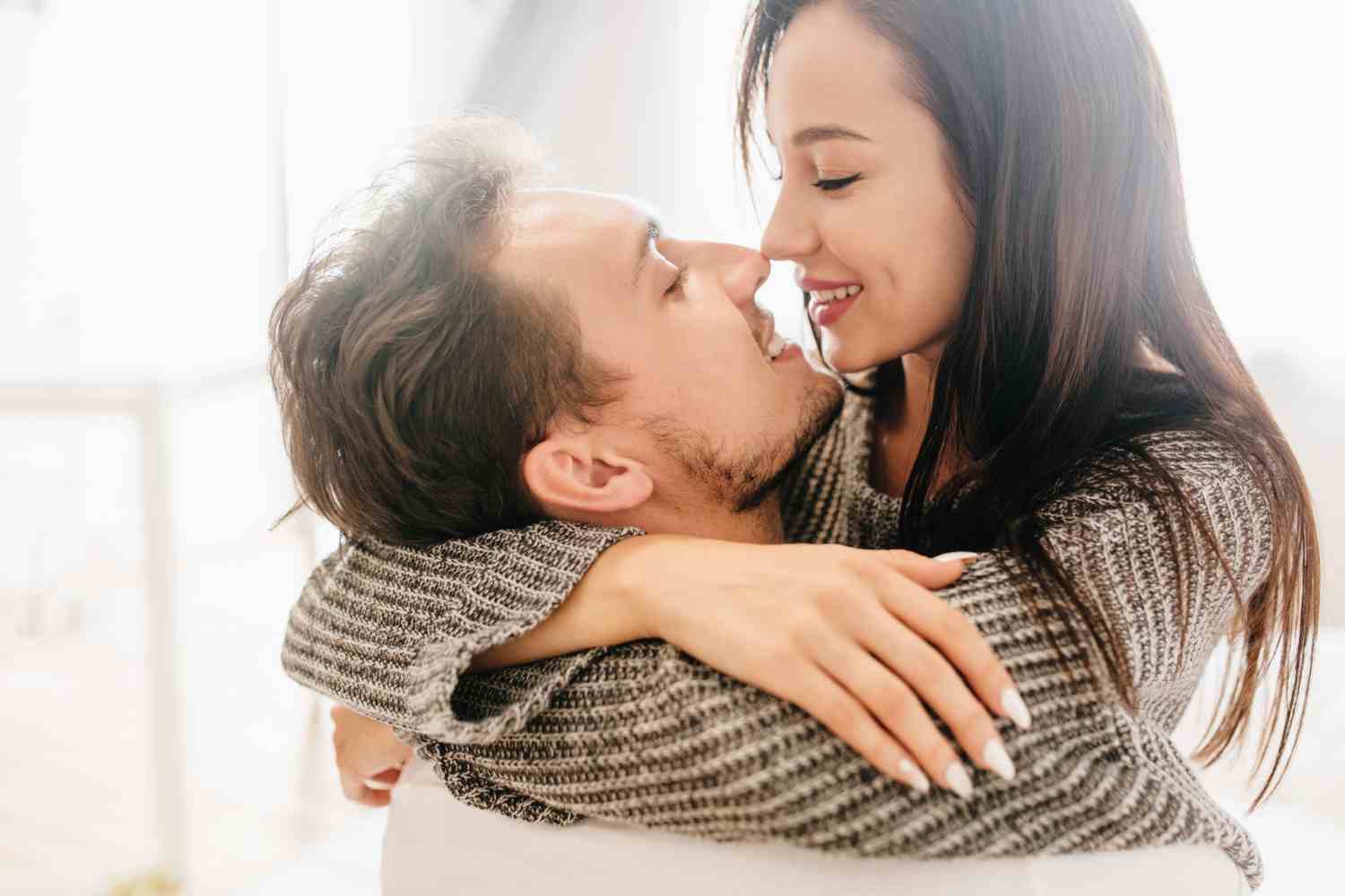 close up portrait kissing couple spending morning together