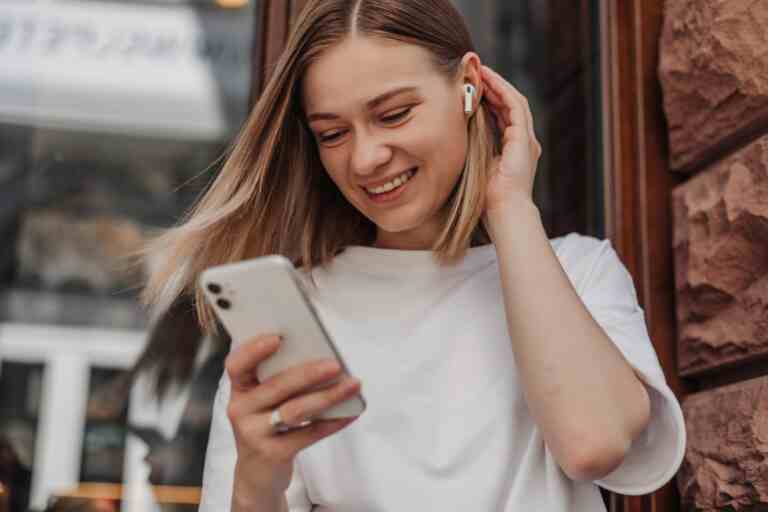 close up view cheerful woman smiling phone