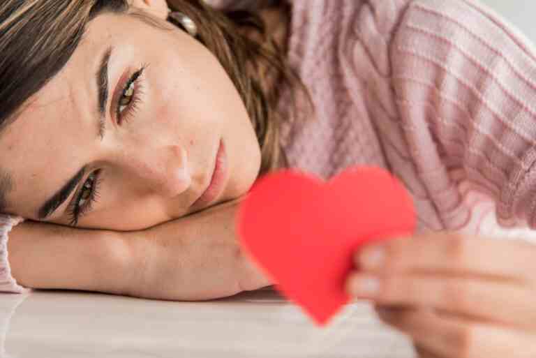 close up woman holding heart