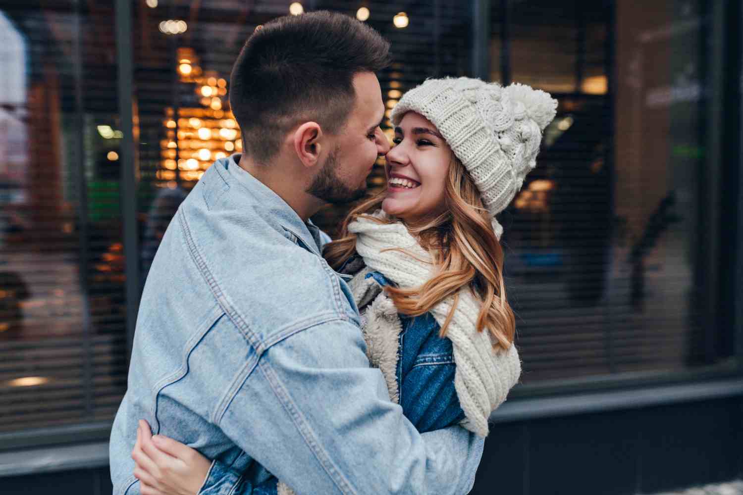 stylish man denim jacket embracing his girlfriend urban street happy caucasian couple posing street during date