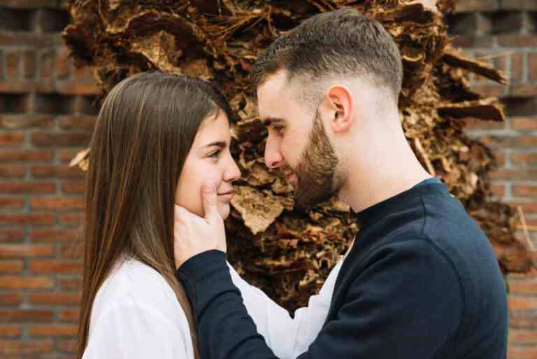 young couple love front tree