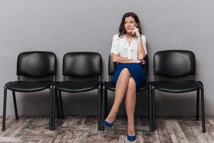 Woman seated with legs crossed