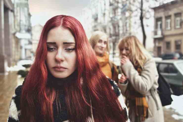 young depressed student girl with red hair who is bullied by her teenage peers disturbed by feelings despair suffering from oppression 306119 643